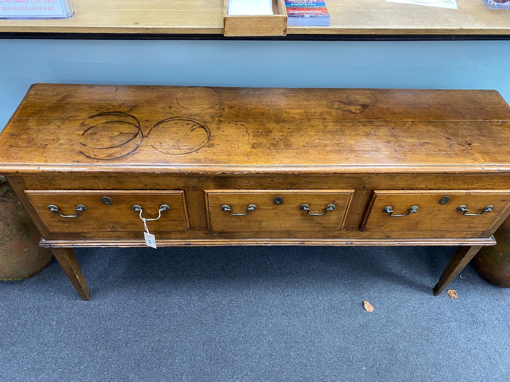 An 18th century elm and fruitwood low dresser, width 160cm, depth 41cm, height 82cm